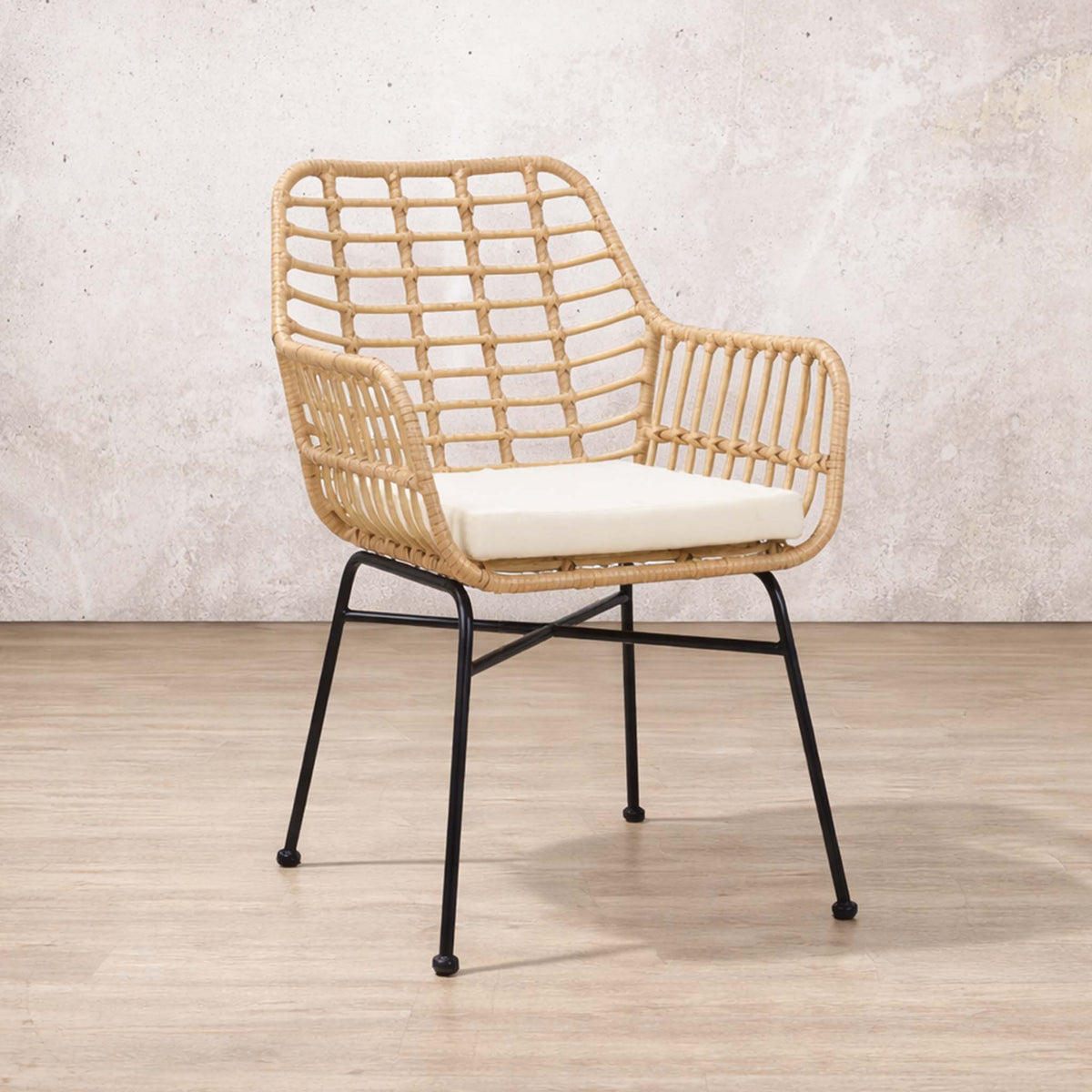 Gallery Everyday Sedona Patio Chairs and Table Set of 3, showing a woven chair with black metal legs against a textured wall.