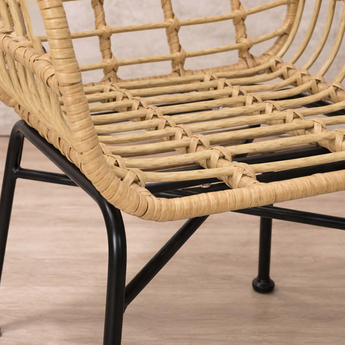 Close-up of the Gallery Everyday Sedona Patio Chairs and Table Set of 3, showing the woven chair detail and black metal legs.