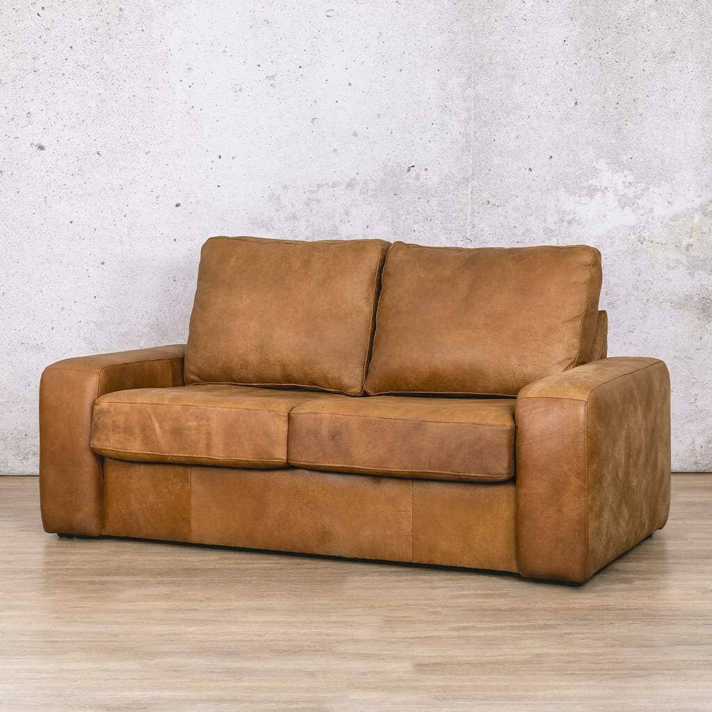 Modern sleeper couch in a cosy living room, perfect for seating and an extra sleeping option for guests. Sleeper couch for sale at Leather Galley.  Czar pecan