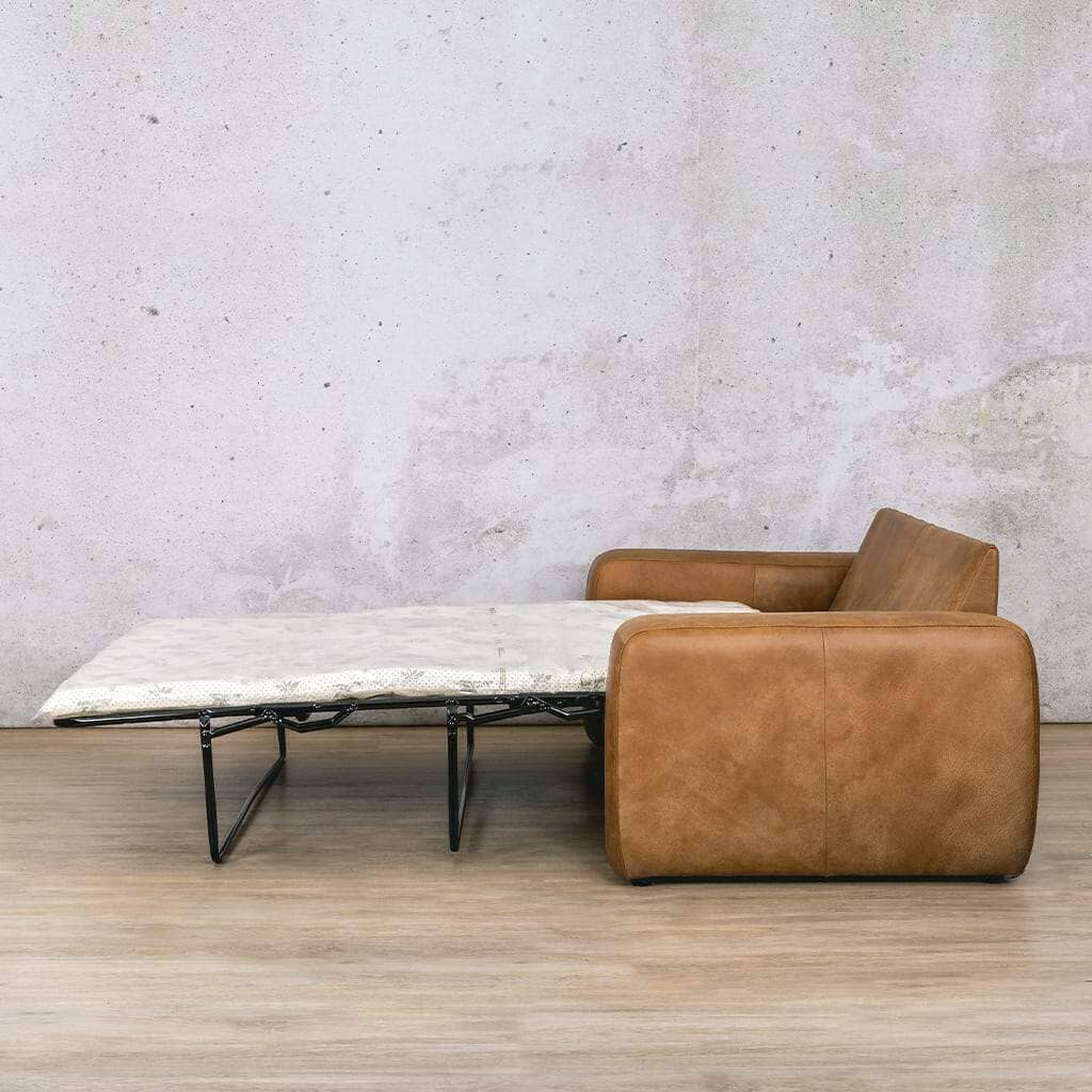 Side view of the Stanford leather sleeper couch folded out into a bed, showcasing its spacious and comfortable sleeping area for guests. Buy your Sleeper Couch today online at Leather Galley. Czar pecan