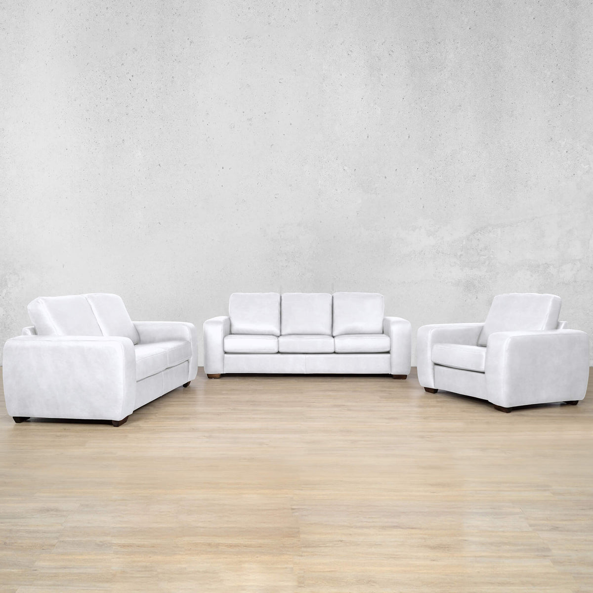 Stanford three-seater couch in tan top-grain genuine leather. Featuring a modern boxy silhouette, this brown leather couch includes full high-density foam seats and wooden legs. Czar White