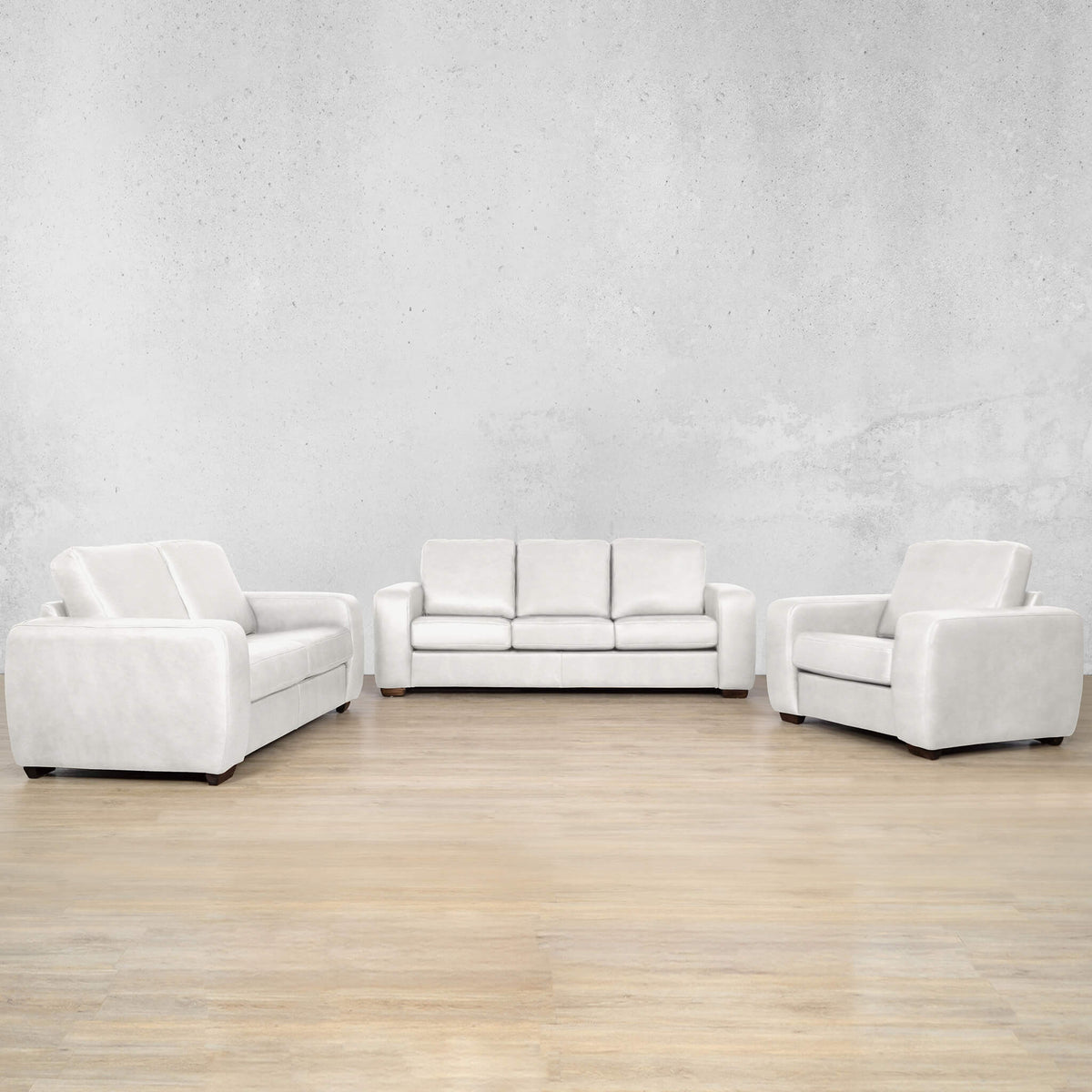 Stanford three-seater couch in tan top-grain genuine leather. Featuring a modern boxy silhouette, this brown leather couch includes full high-density foam seats and wooden legs. Urban White