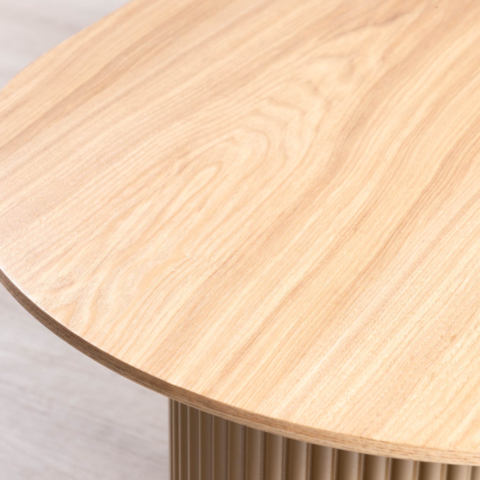 Close-up of Sybil coffee table's natural wood grain tabletop surface. 
