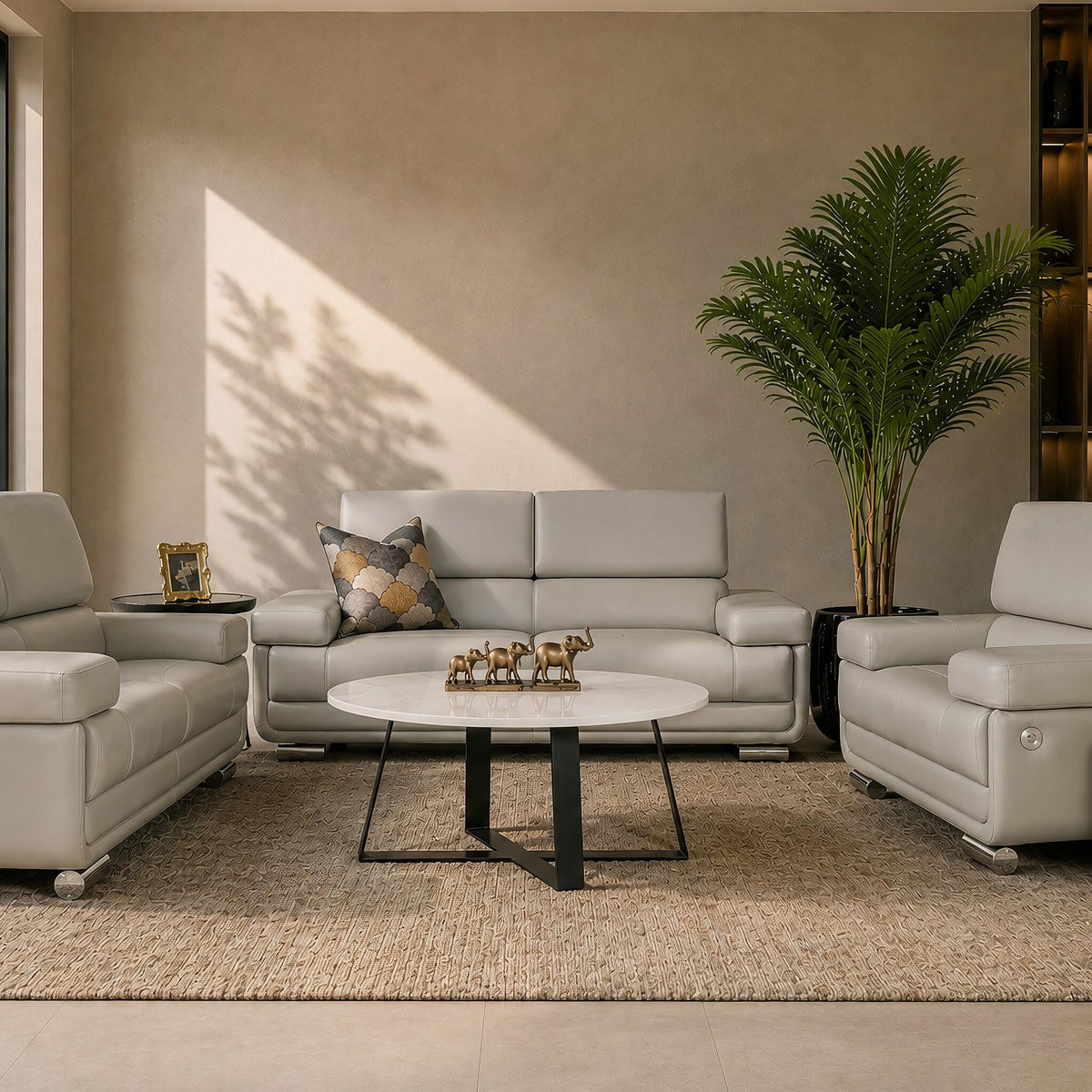 Leather Gallery Tobago 3+2+1 Leather Lounge Suite in Grey, styled with matching leather seating, a round coffee table, and neutral décor in a modern living room.
