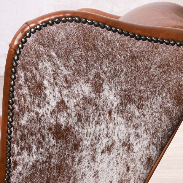 Torin Wingback Armchair – Close-Up of Armrest Detailing – Full Genuine Leather and Nguni-Inspired Fabric with Metal Stud Accents | Leather Gallery