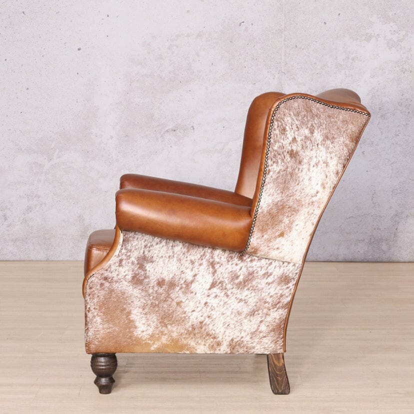 Torin Wingback Nguni Leather Occasional Chair – Side View – Timeless Silhouette with Scroll Arms and Studded Trim
