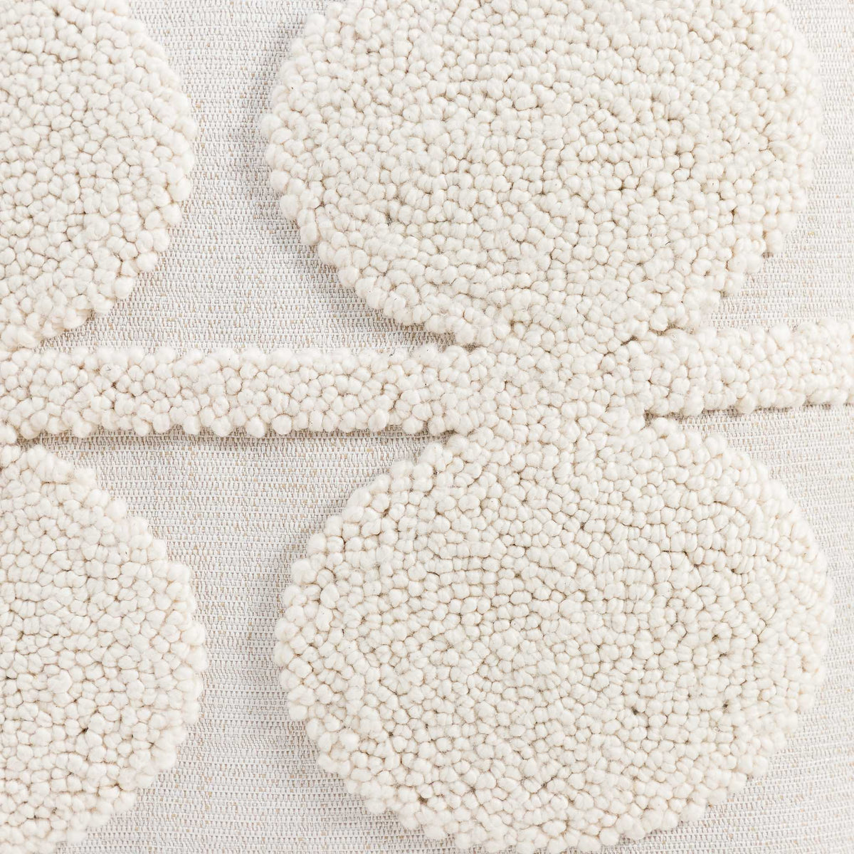 Leather Gallery Halo Magnolia White Cushion, featuring raised circular tufted detailing in a soft warm white finish.