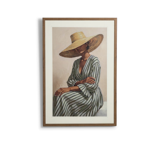 Belladonna I - Kia Artwork by Leather Gallery featuring a seated woman in a striped dress and oversized woven sunhat, framed in natural wood tones.