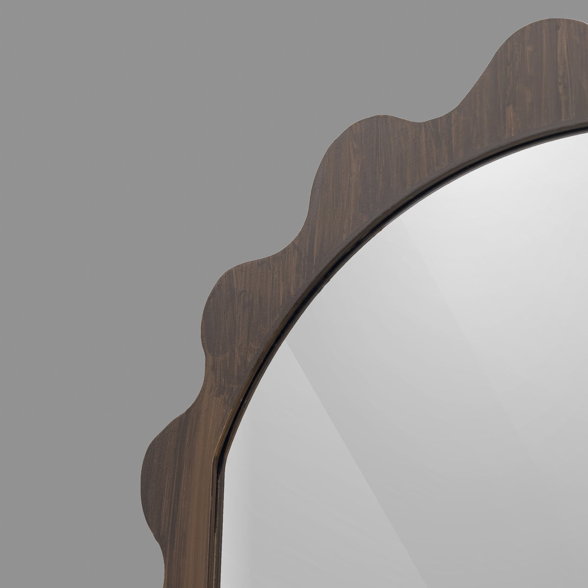 Leather Gallery Morgana Wall Mirror in Brown, featuring an elongated scalloped frame with an antique-glaze finish.