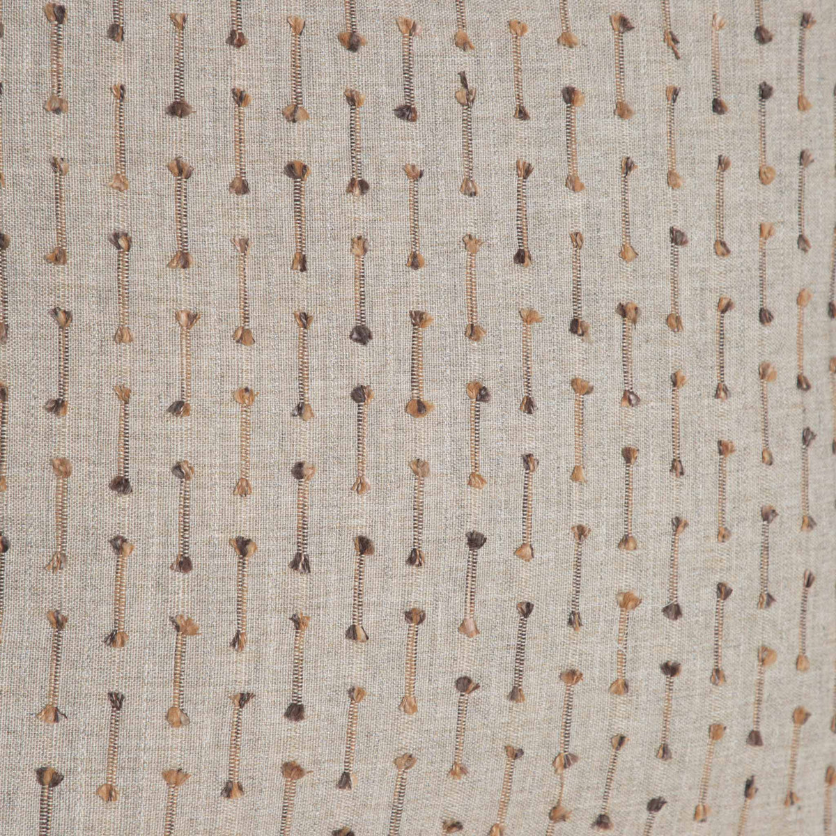 Leather Gallery Veyra Riverstone Cushion, featuring a soft neutral woven finish with delicate brown and golden stitched detailing.