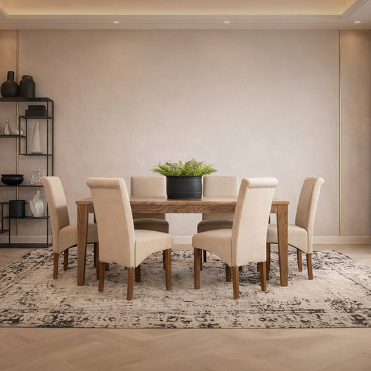 Leather Gallery Willow & Windsor 6 Seater Dining Set, featuring a wooden dining table with six beige chairs on a patterned rug.