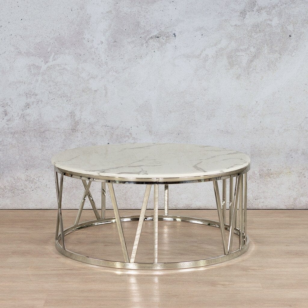 Zoya Coffee Table with a white marble look top and a geometric silver base, a stylish centrepiece for modern living rooms.