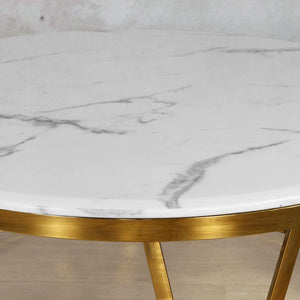 A close-up view of the Zoya Coffee Table's white marble-look top, highlighting its sleek and polished finish, ideal for modern interiors.