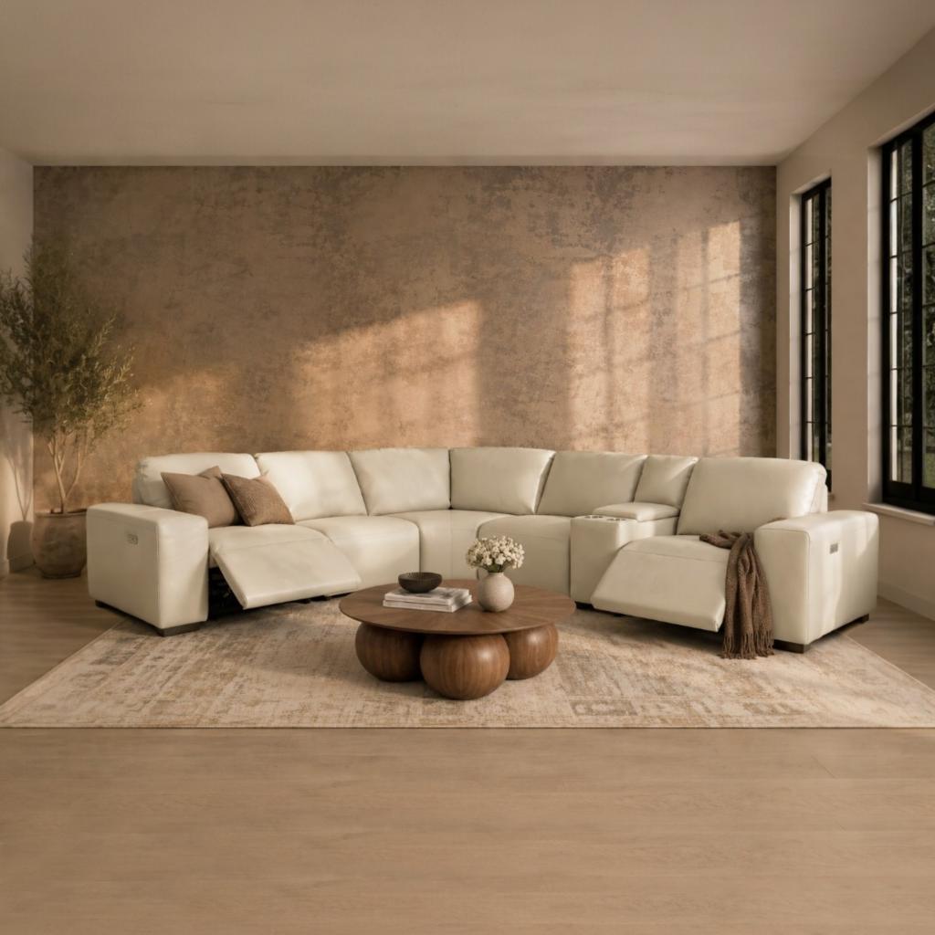 Zurich leather corner couch in a luxe beige hue, shown in a rustic lounge interior. | L shape couches, l shape couches for sale, corner couch, beige couch, corner couch with recliner