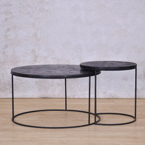 Two Callie Nesting Coffee Tables sliding into each other | Set Of 2 - Black Parquet Wood Coffee Table | Coffee Table Sets | Coffee Table Collection at Leather Gallery | Coffee Tables for sale | Modern Coffee Table | Coffee Tables | coffee tables south africa | round coffee table | small round coffee table | nesting tables | small coffee table | Leather gallery furniture stores | black coffee table