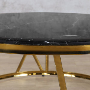 Close up view of the table top of the Francesco Coffee Table - Black Marble Look Top with Gold Base  | Coffee Tables at Leather Gallery | Coffee Tables for sale | Modern Coffee Table | Coffee Tables | coffee tables south africa | round coffee table | wood coffee table | small coffee table | small round coffee table | marble coffee table | Leather gallery Furniture Stores | black coffee table